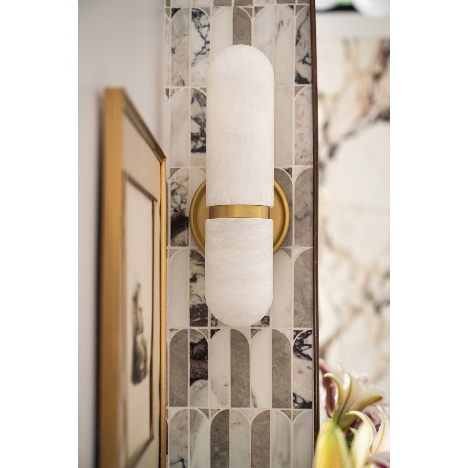 The unique natural veining of the alabaster shade.