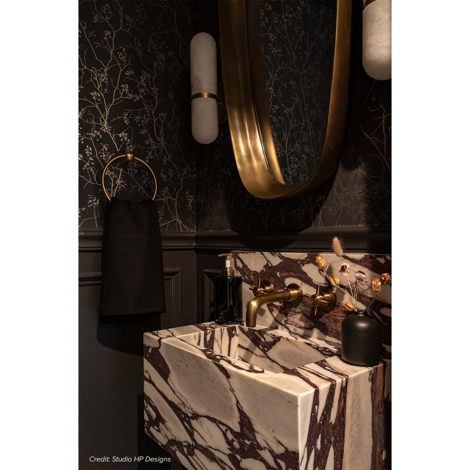Two Salon Alabaster Wall Lamps flanking a bathroom mirror.