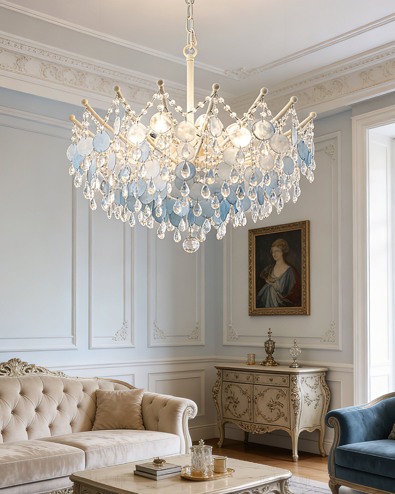 The medium-sized Sasha Chandelier illuminating a master bedroom.
