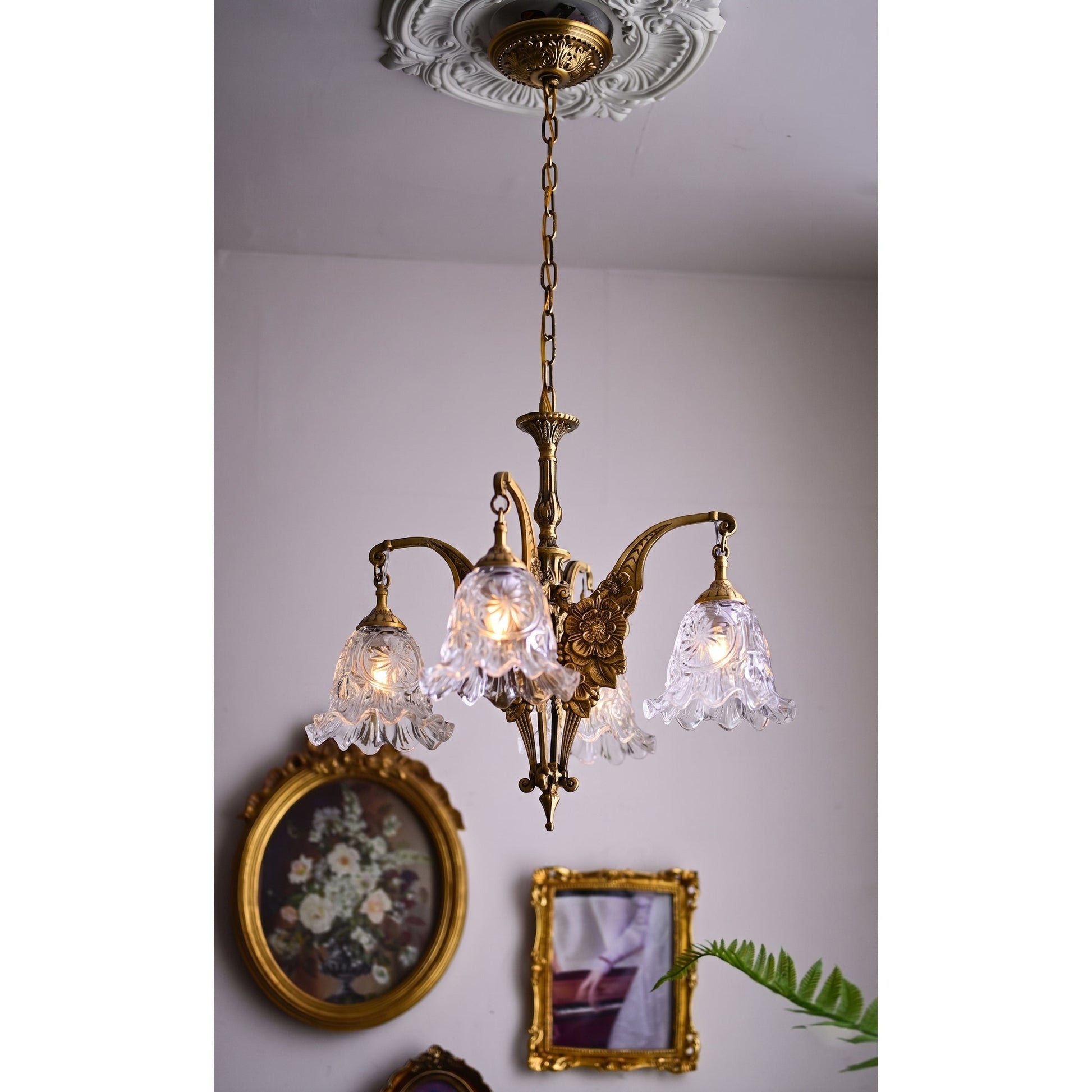 The Savannah Bell Chandelier in a traditional living room with high ceilings.