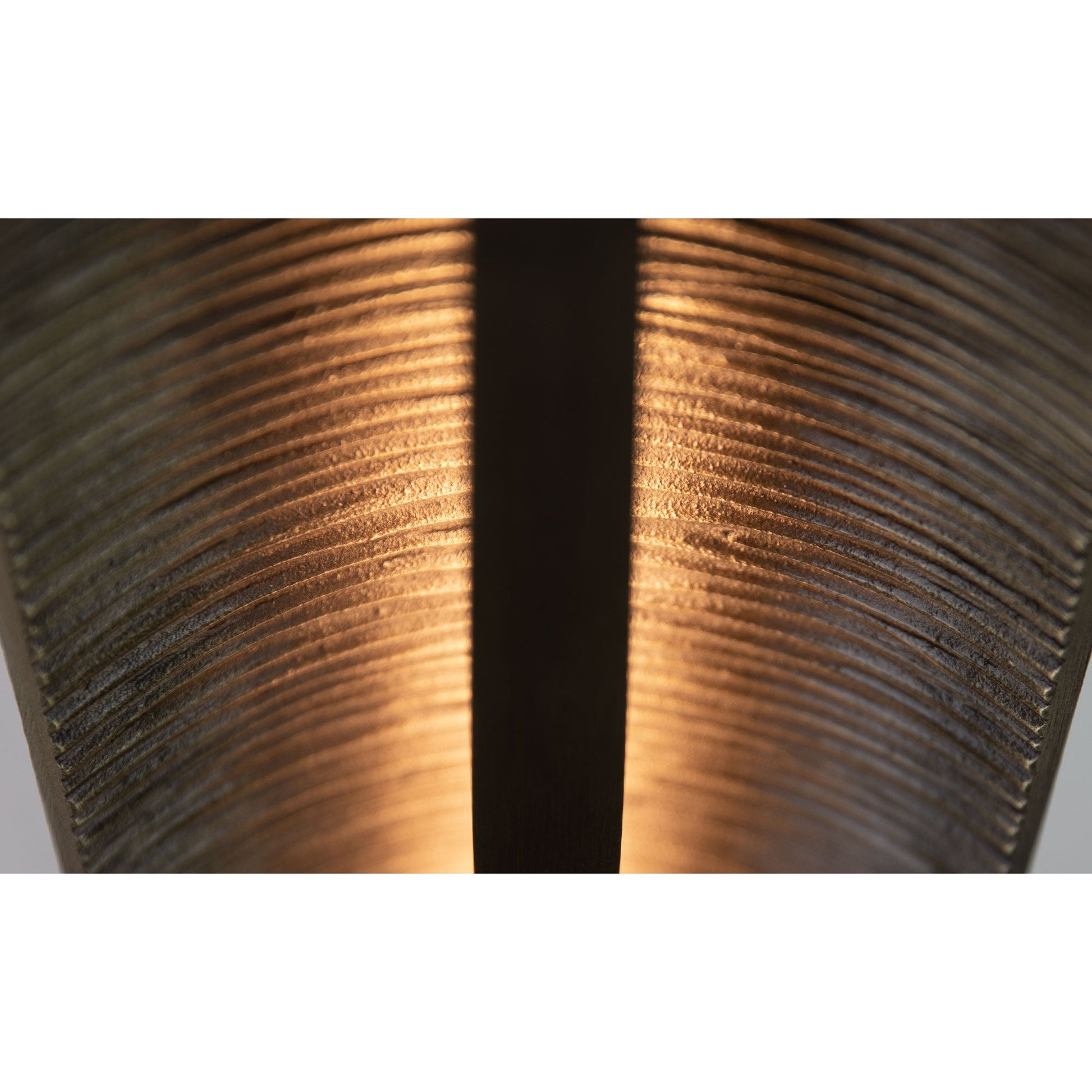 Close-up on the texture of the bronze finish.
