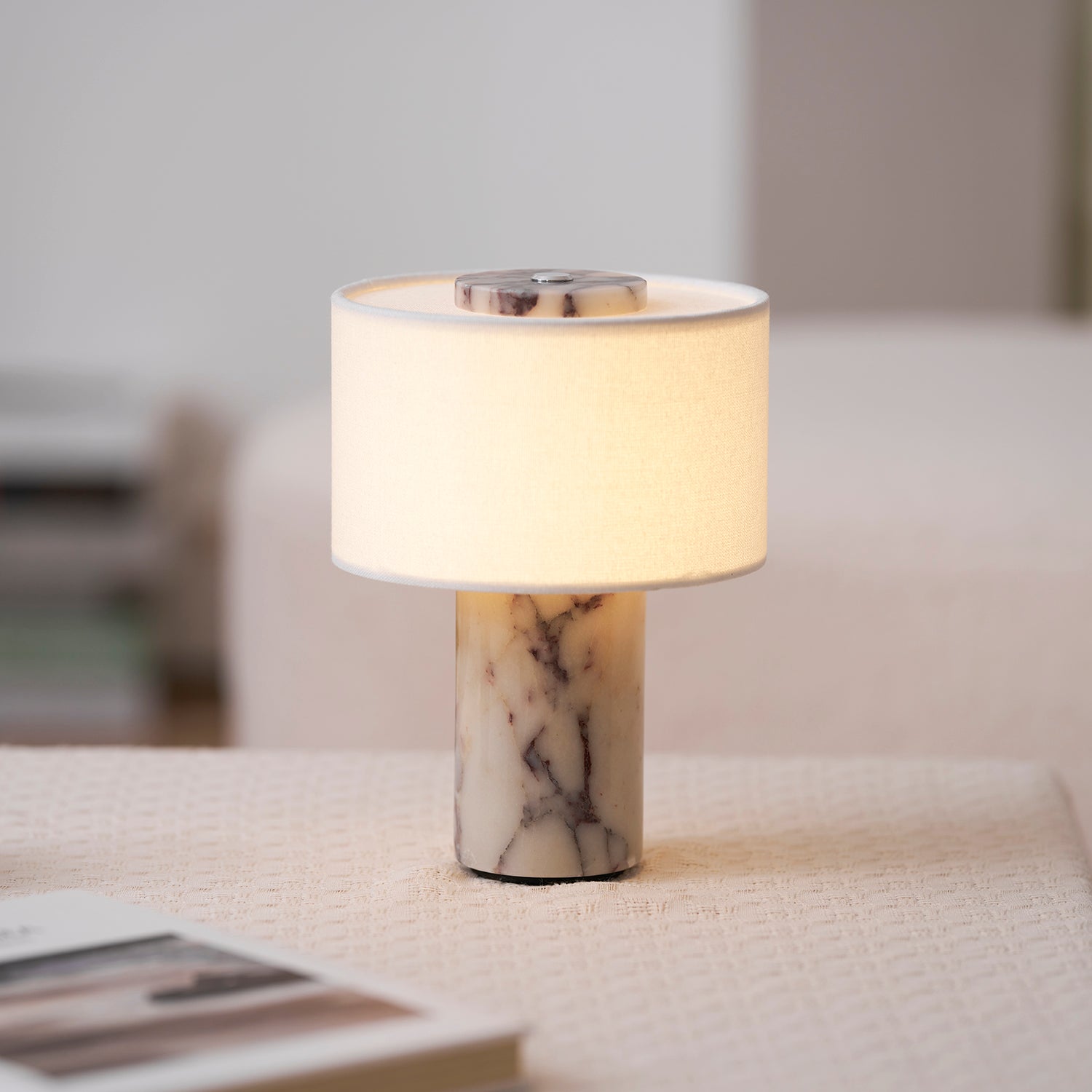 Sediment Table Lamp shown lit in a dark room.