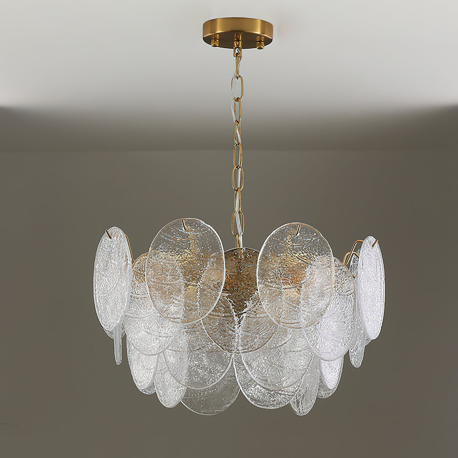 The Seraphina chandelier unlit, highlighting the texture of the glass discs.