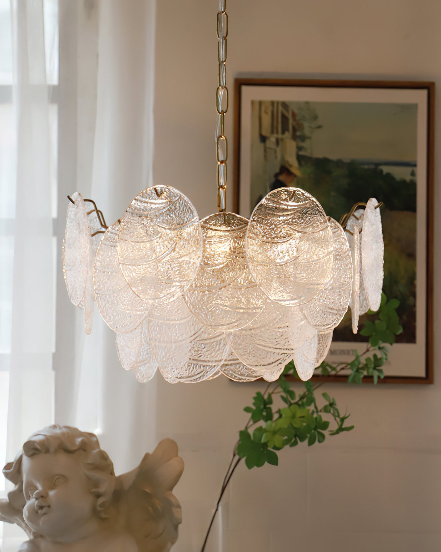 The Seraphina Halo Chandelier hanging in a modern living room.