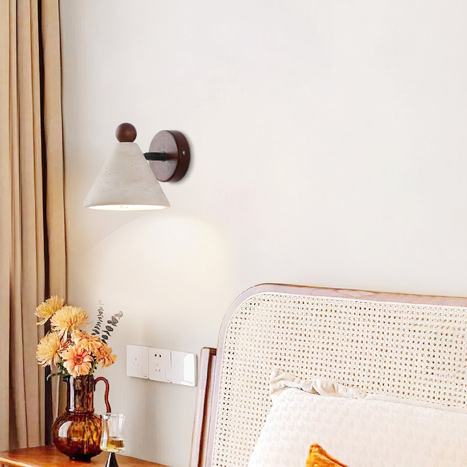 A pair of Tiber Travertine Wall Lights installed as bedside reading lamps.