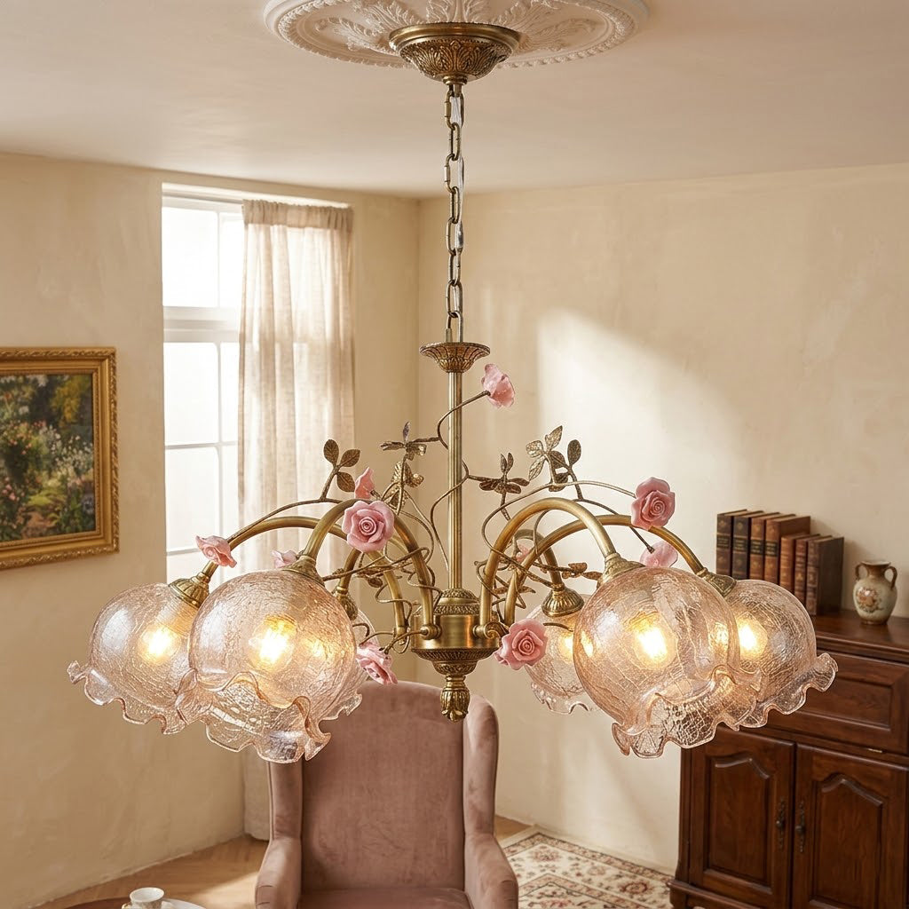 Close-up of the Serenade Chandelier's ceramic flower and brass detail.