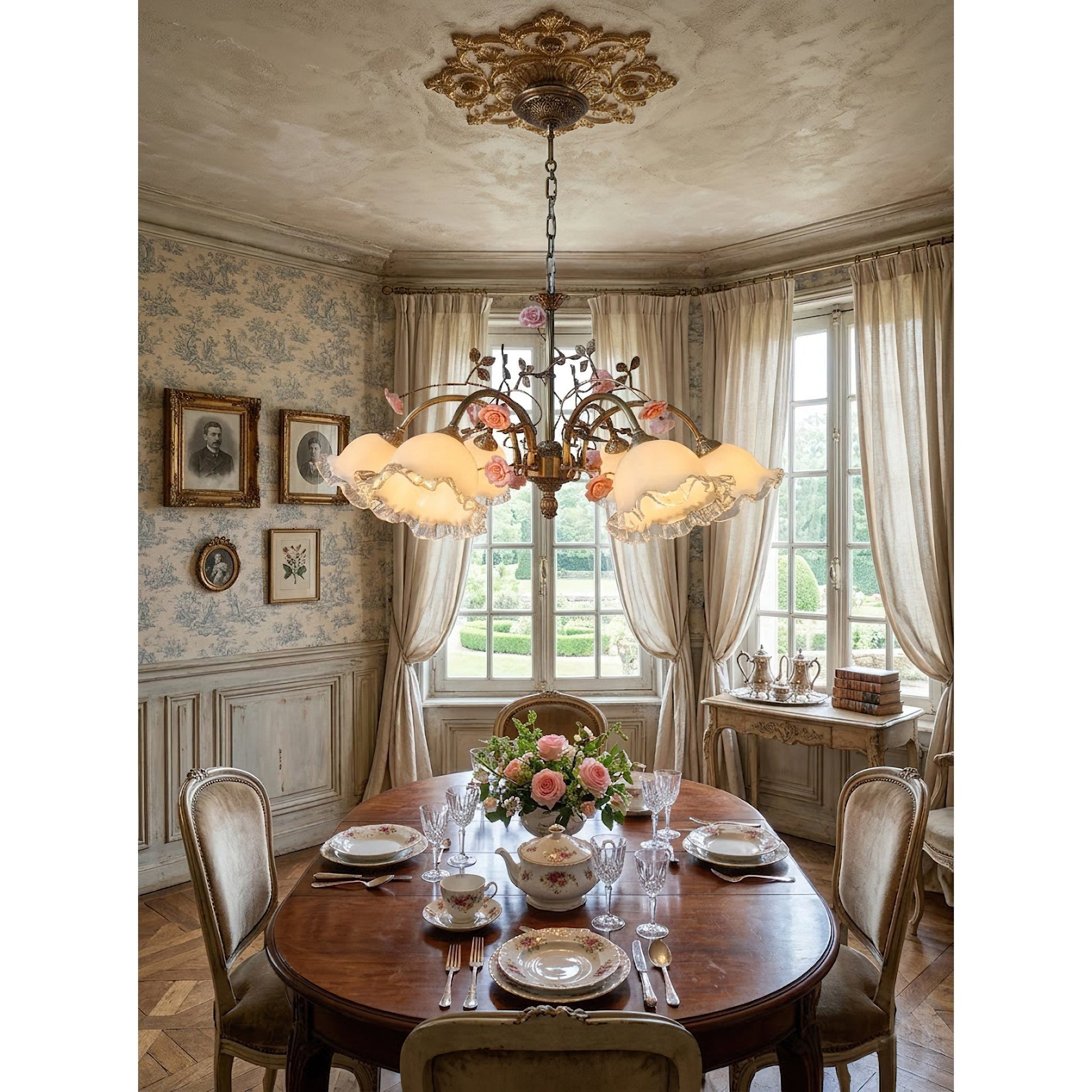 The Serenade Chandelier hanging over a dining table.