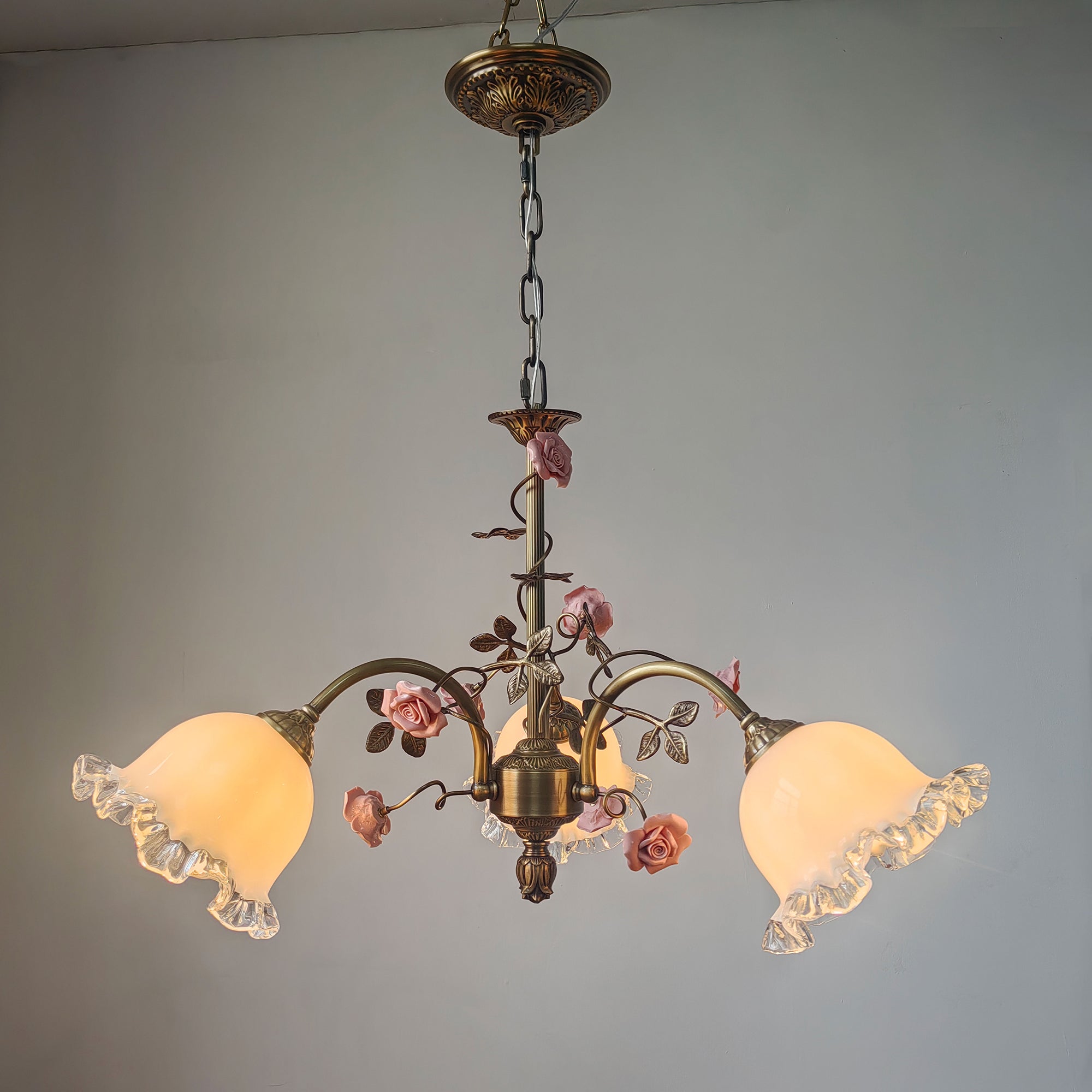 Angle view of the Serenade Chandelier highlighting its floral accents.