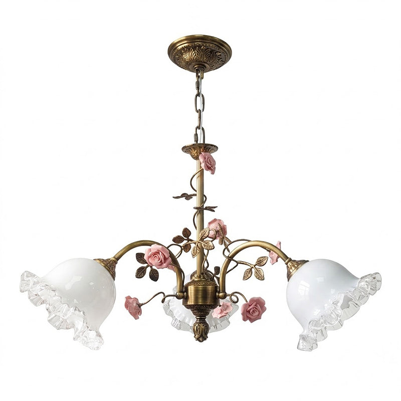 The Serenade Chandelier hanging over a dining table.