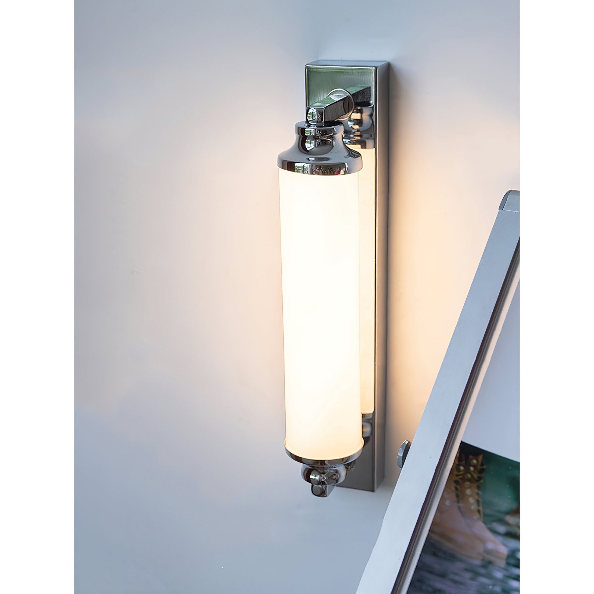Sheridan Wall Lamp shown in a contemporary bathroom setting.