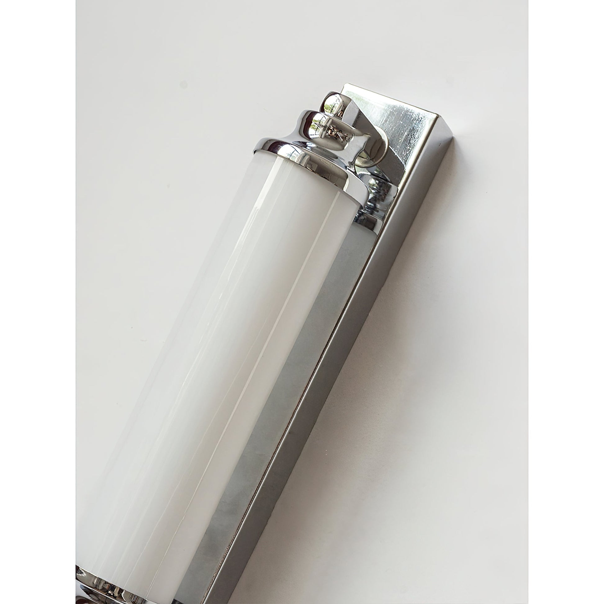 Angled view of the Sheridan Wall Lamp highlighting its sleek, cylindrical design.