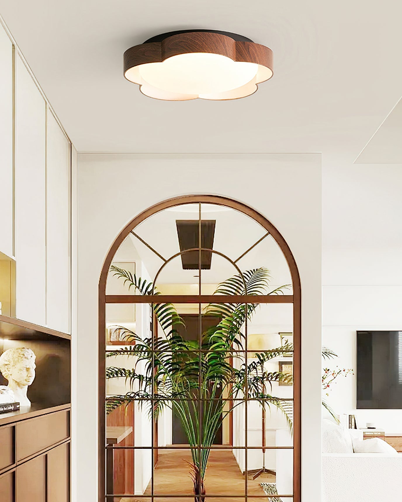 Sika Ceiling Lamp illuminating a modern living room.