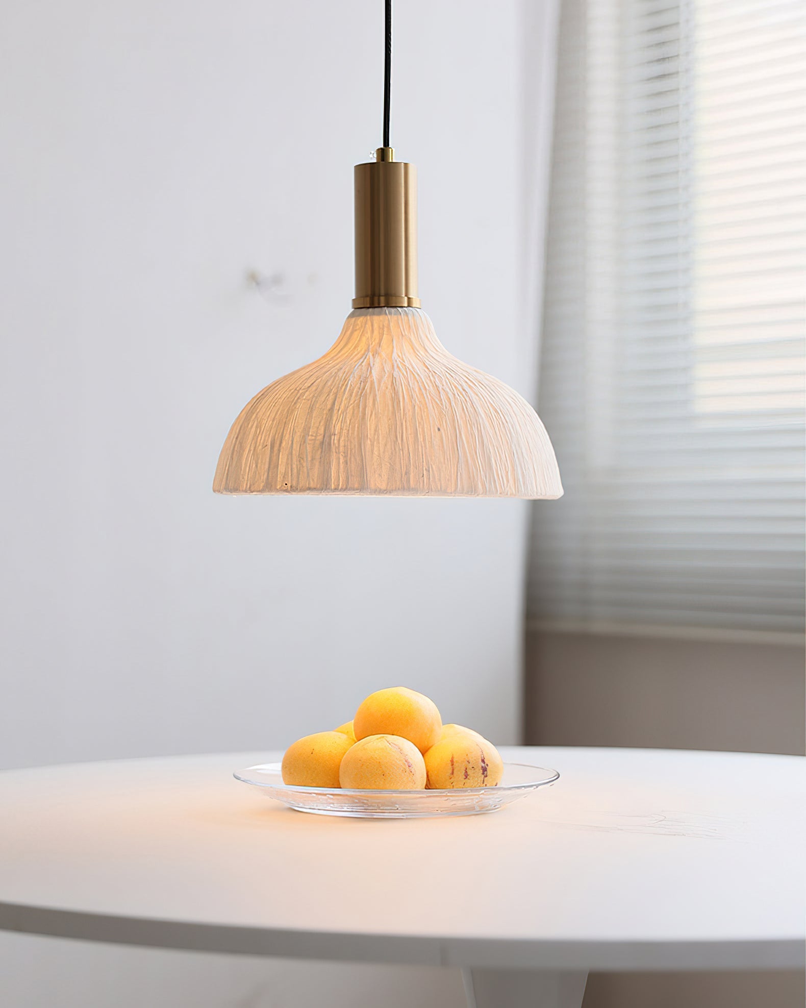 The natural, crinkled texture of the Siya Pendant's paper shade.