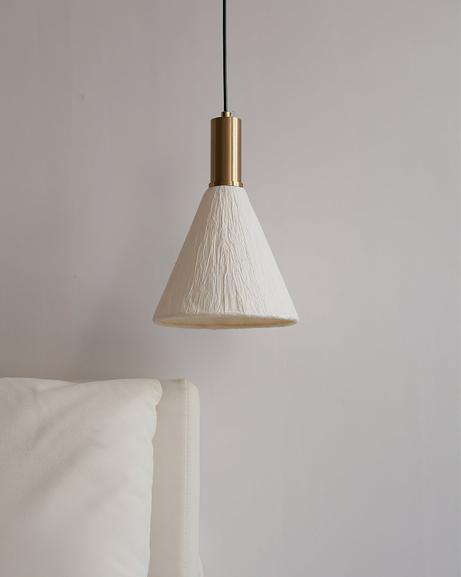 The pure white paper shade of the Siya Pendant Light, unlit.