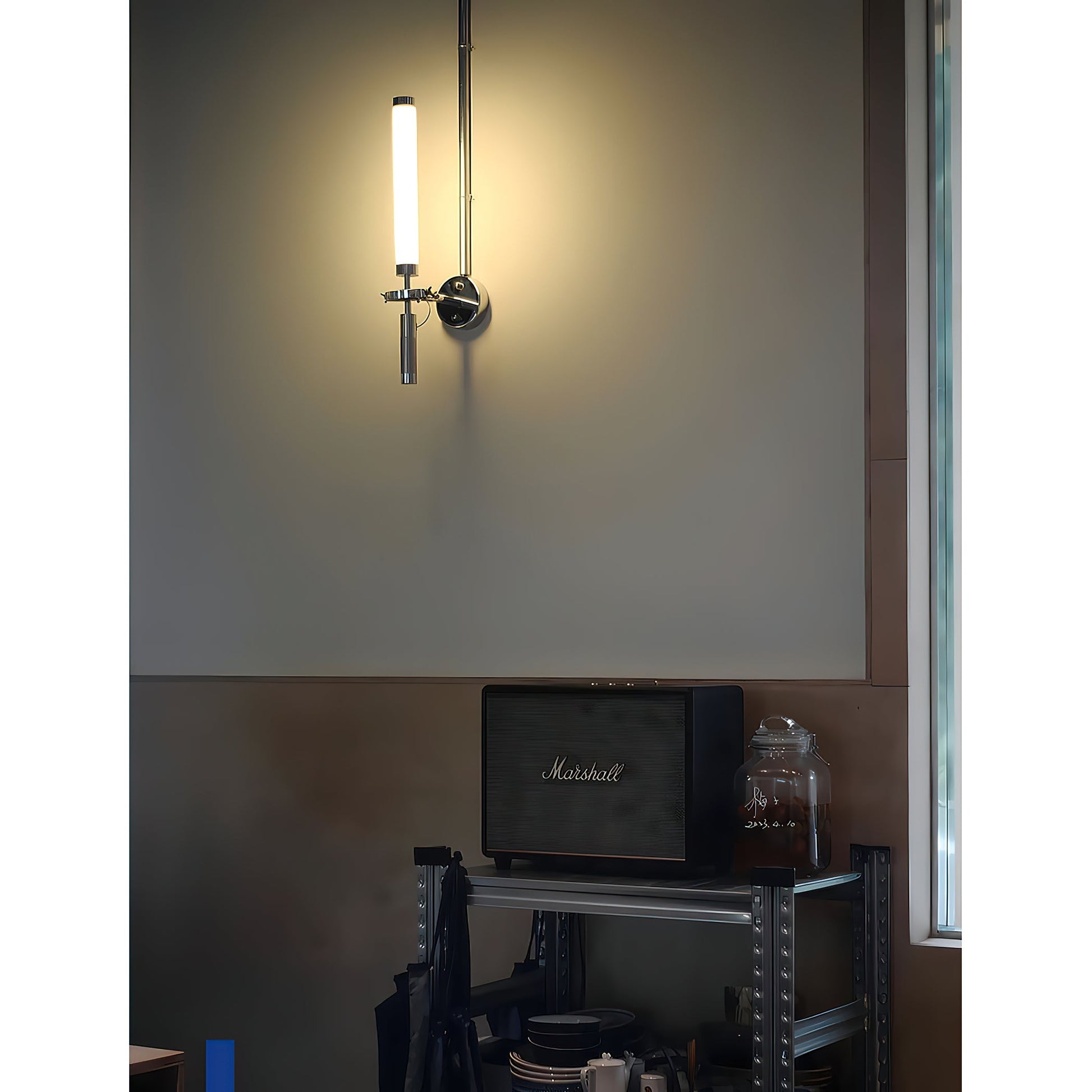 The Skylark Wall Lamp unlit, showcasing its reflective chrome surface.
