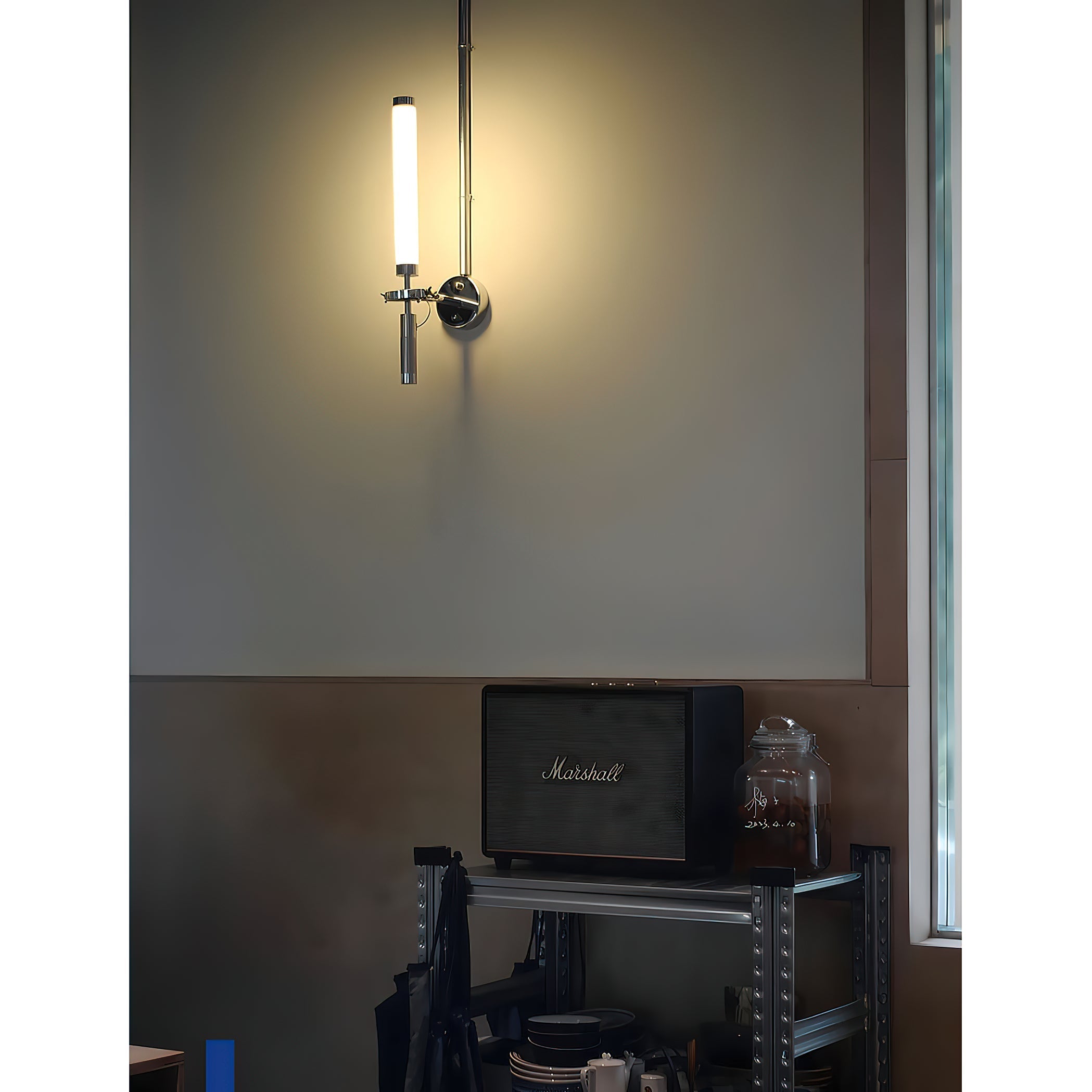 The Skylark Wall Lamp unlit, showcasing its reflective chrome surface.