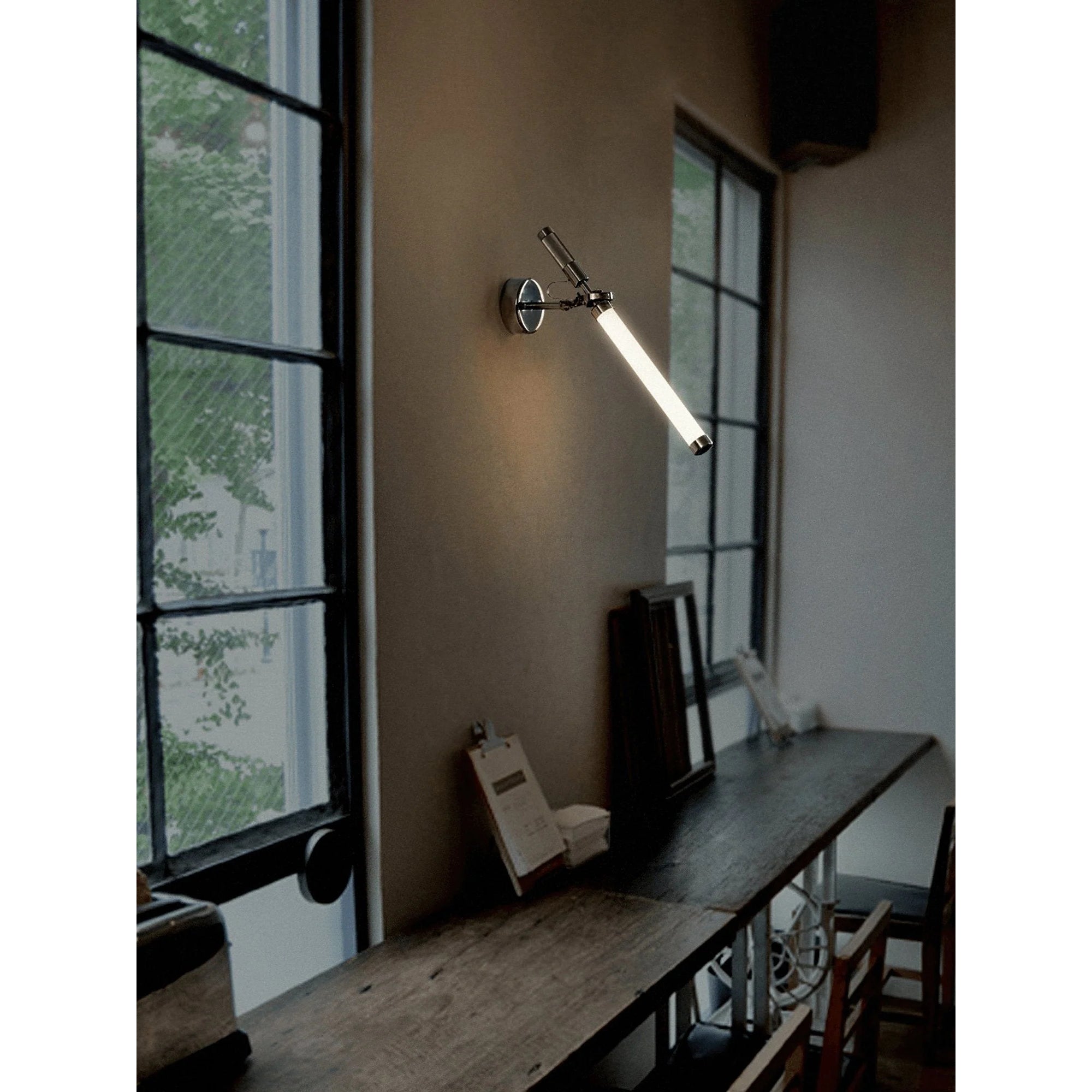 Skylark Wall Lamp shown in a hallway for scale.