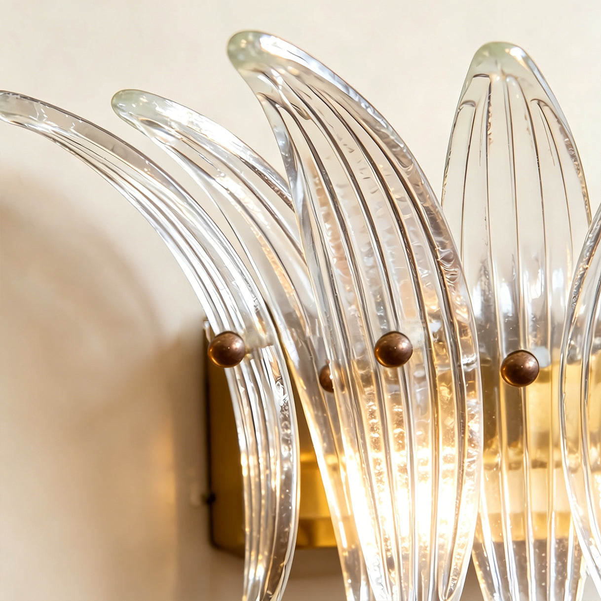 Gold Smeralda Wall Sconce highlighting its luxurious appeal.
