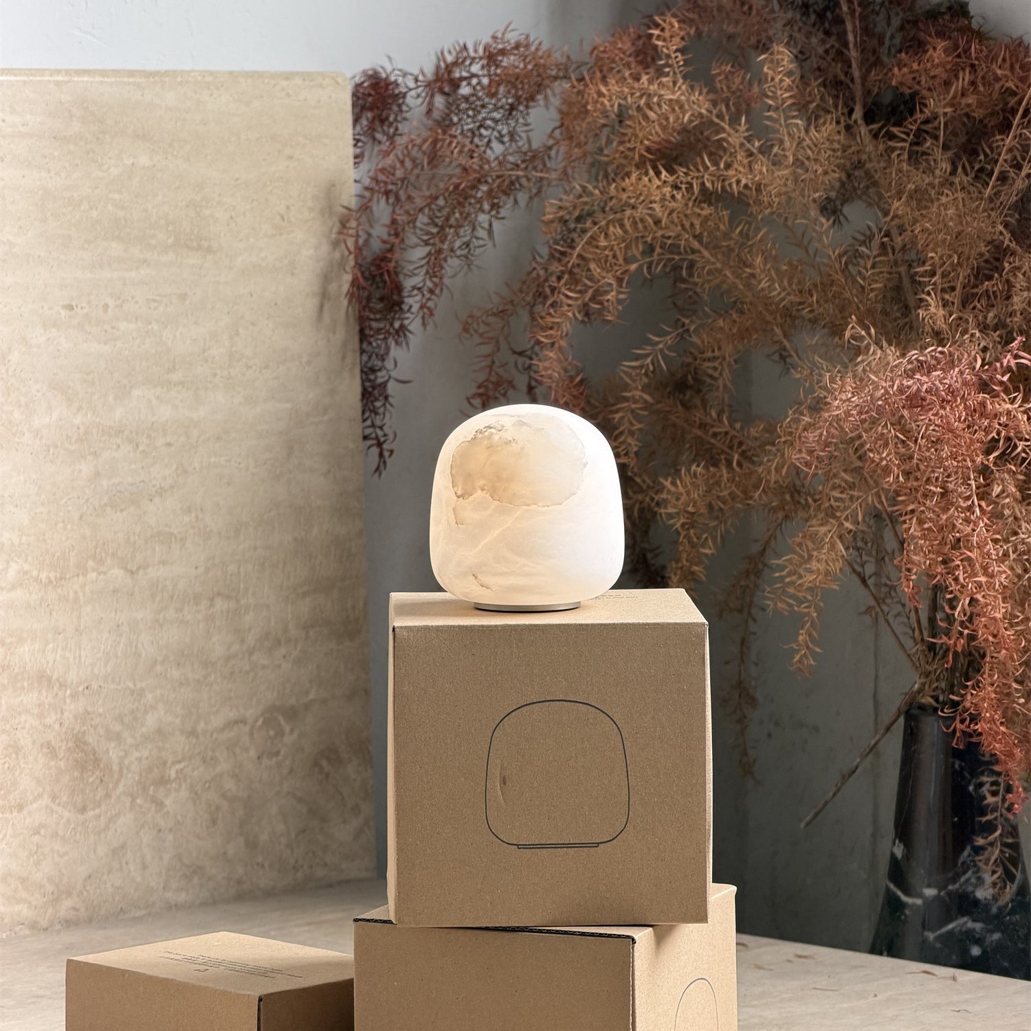 Front view of the Alabaster Petite Portable Lamp with neutral white light.