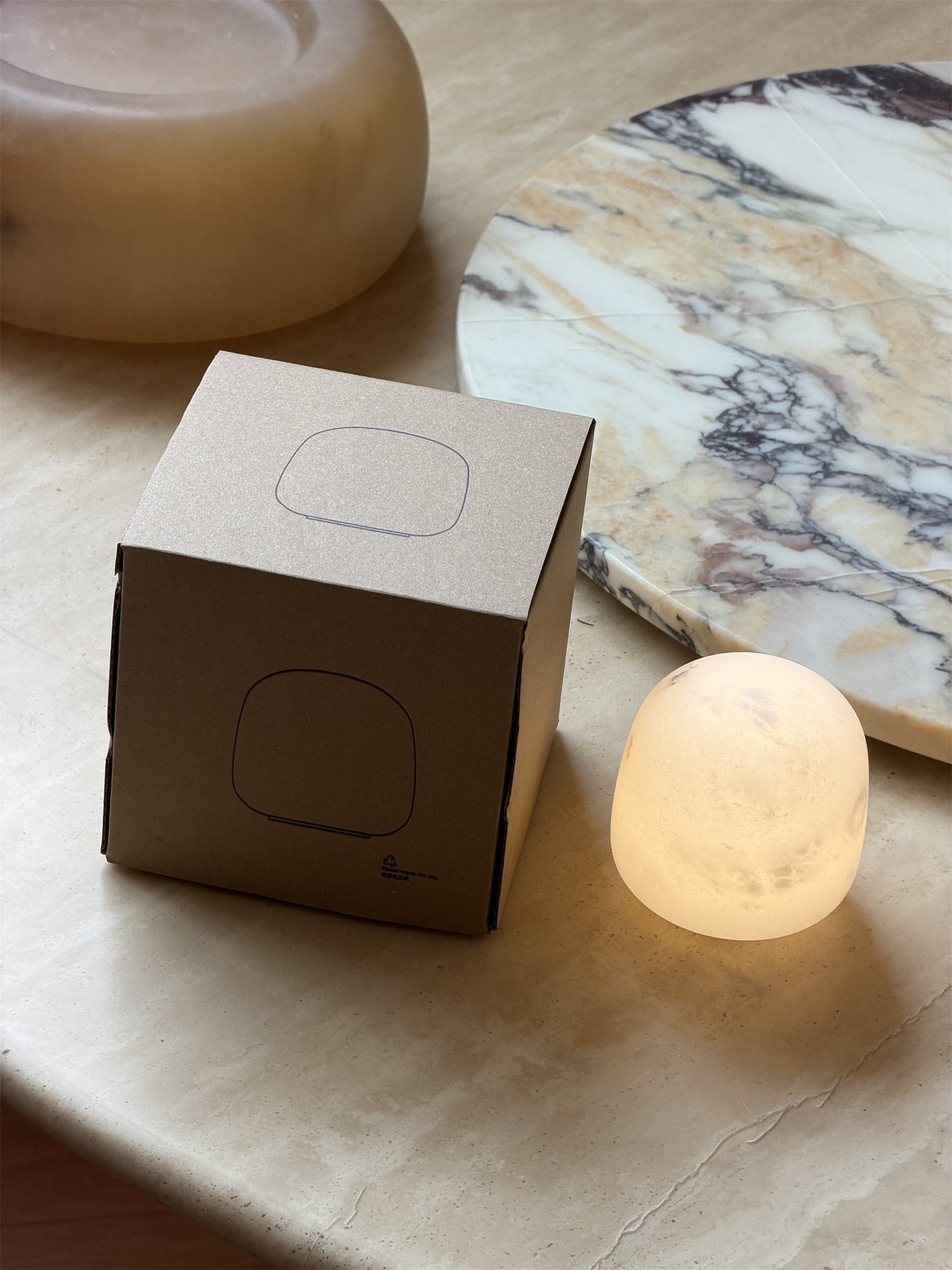 The short alabaster lamp with an amber glow.