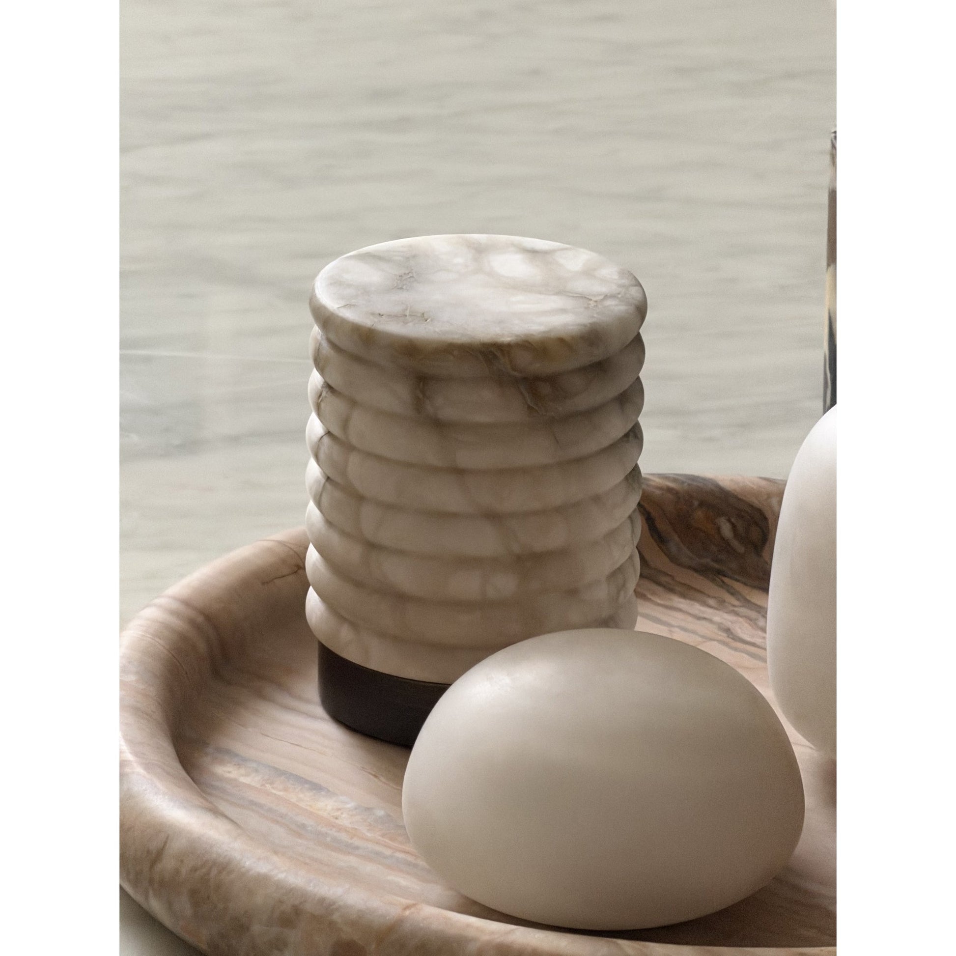 A collection of Alabaster Petite lamps showing natural variations.