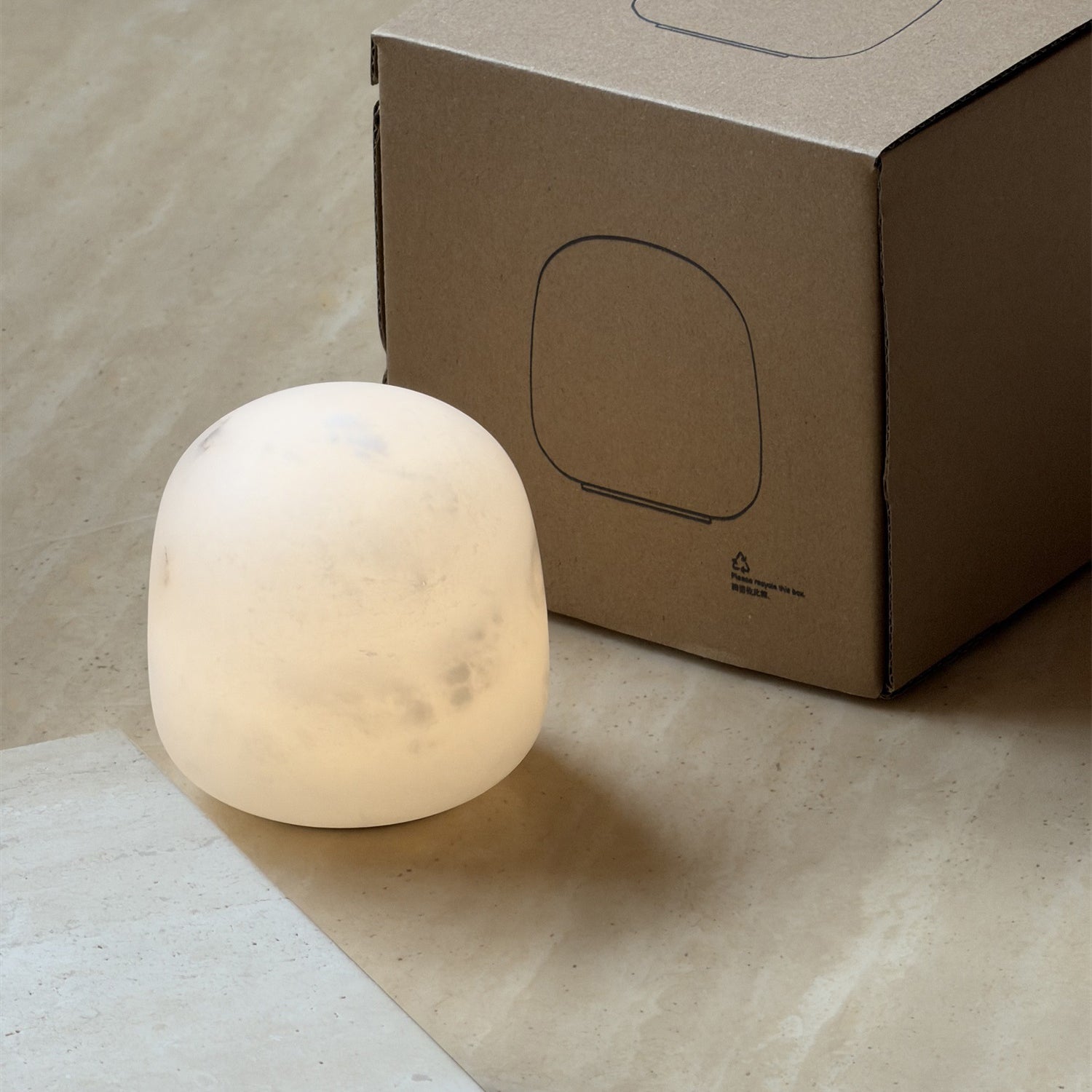 Side profile of the short Alabaster Petite Portable Lamp.