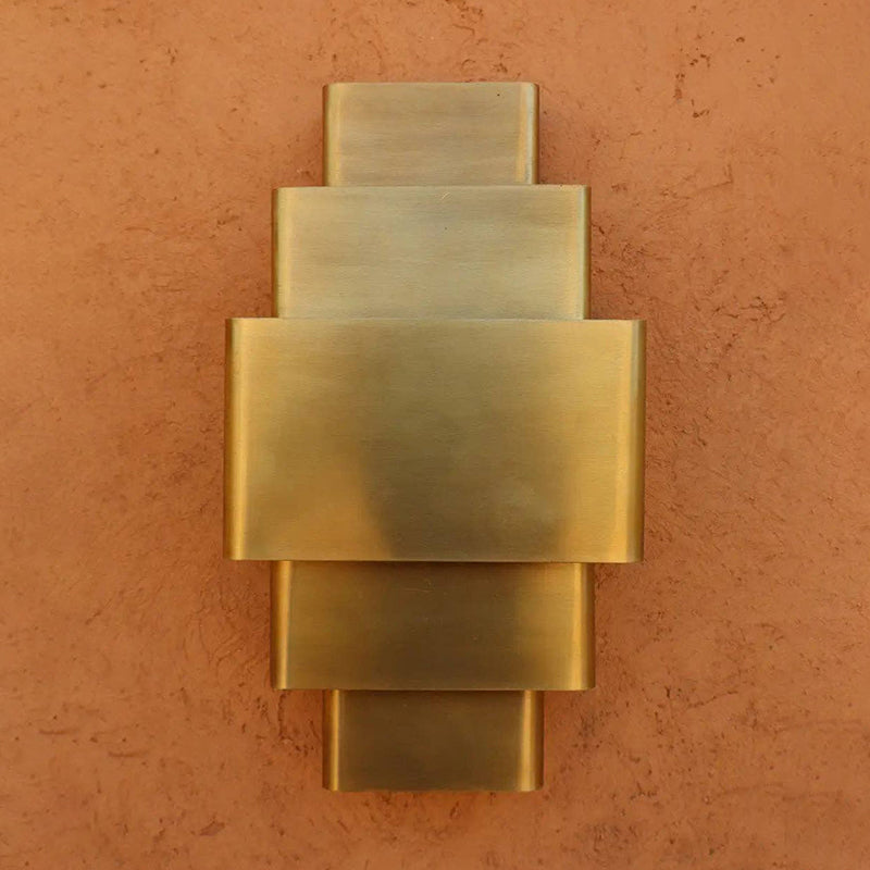 Lifestyle image featuring the Sofia Brass Wall Lamp.