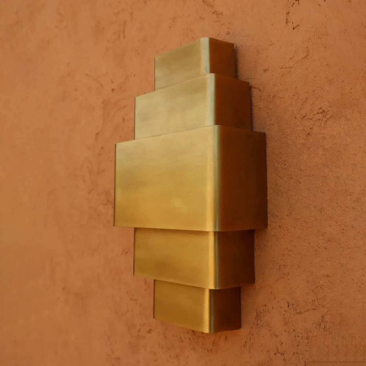 Close-up of the Sofia Brass Wall Lamp's finish.