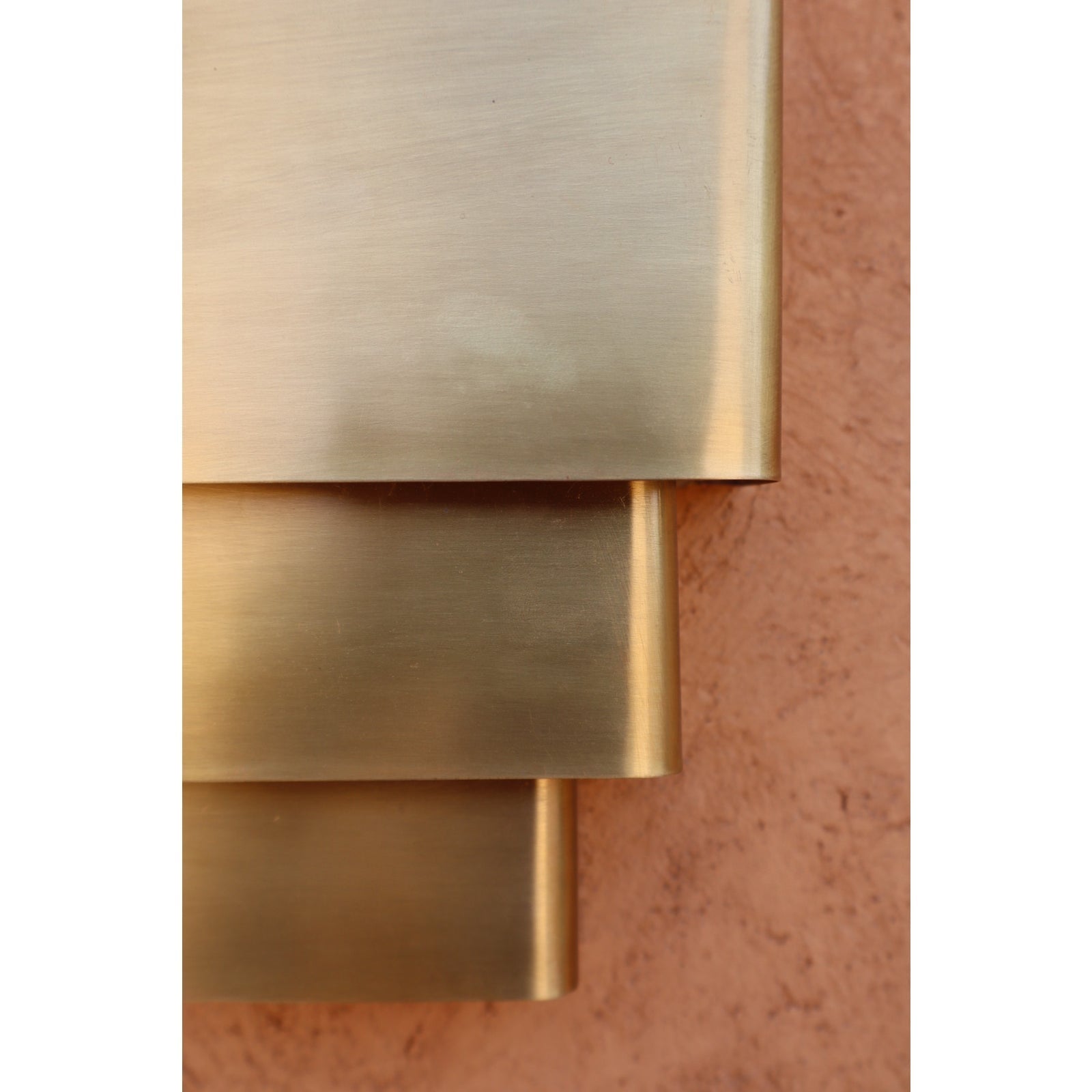 Unlit Sofia Brass Wall Lamp showcasing its form.