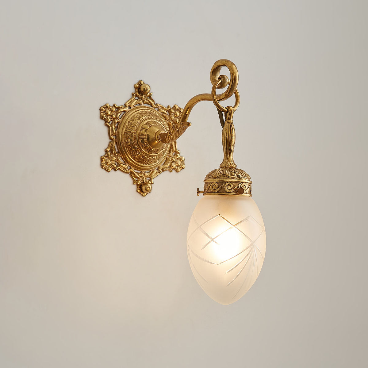 Angled view of the two-head Solange wall lamp.