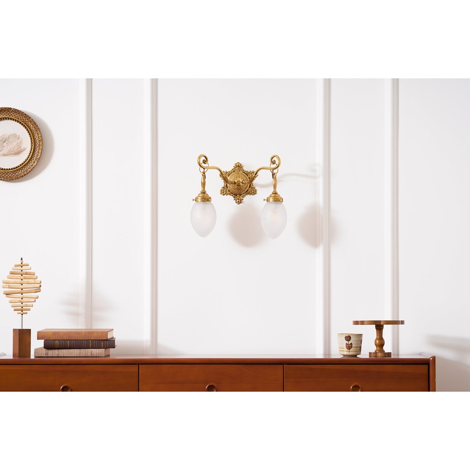 The Solange wall lamp shown against a dark wall for contrast.