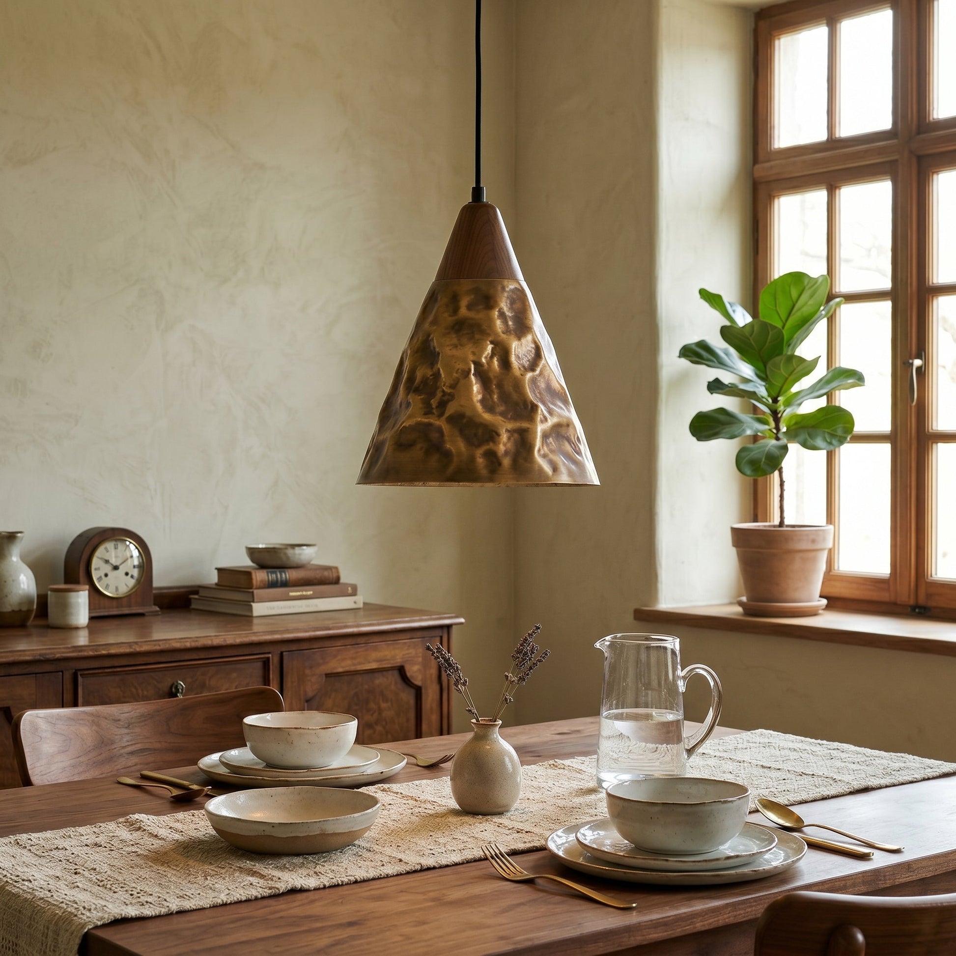 Close-up of the brass material and antique bronze finish on the Boyd Pendant Lamp.