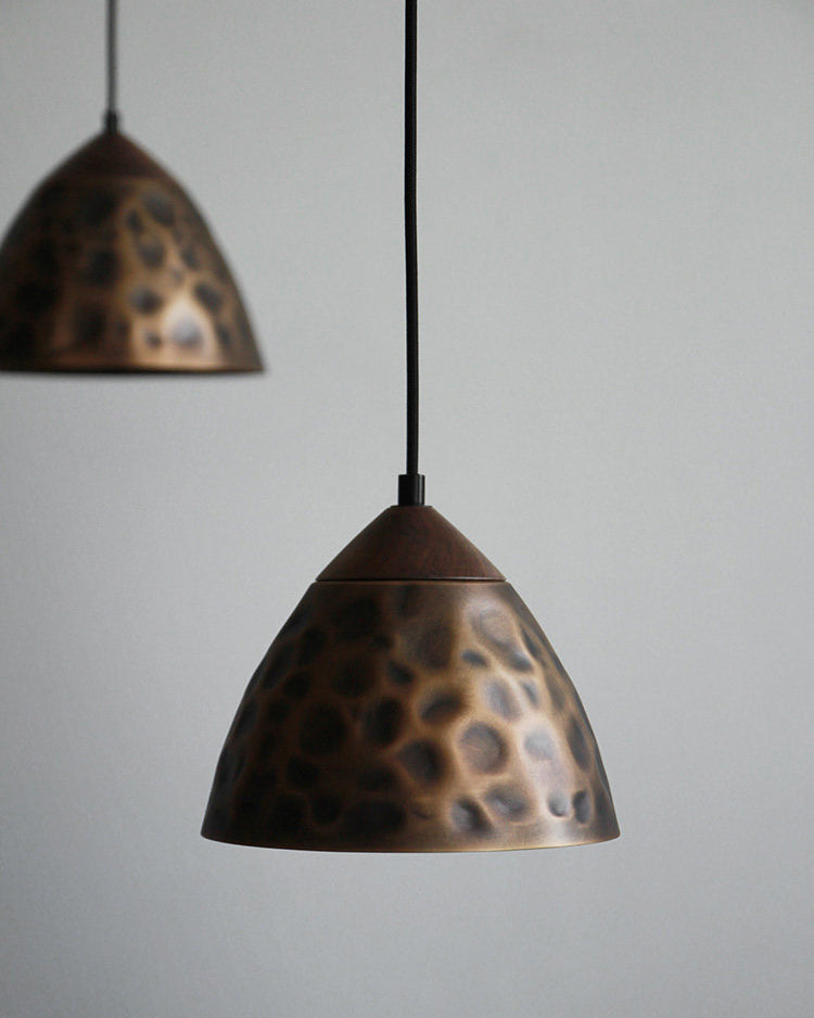 Angled view of the Boyd Pendant Lamp Model A in antique bronze.