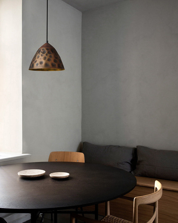 Angled view of the Boyd Pendant Lamp Model B in antique bronze.