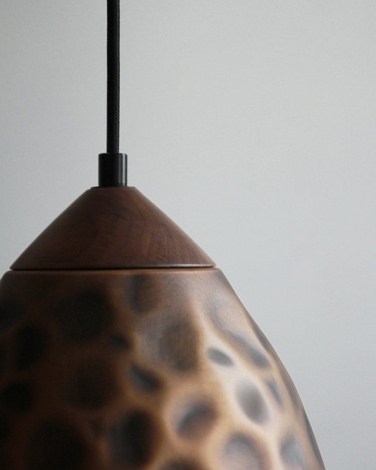 Angled view of the Boyd Pendant Lamp Model E in antique bronze.
