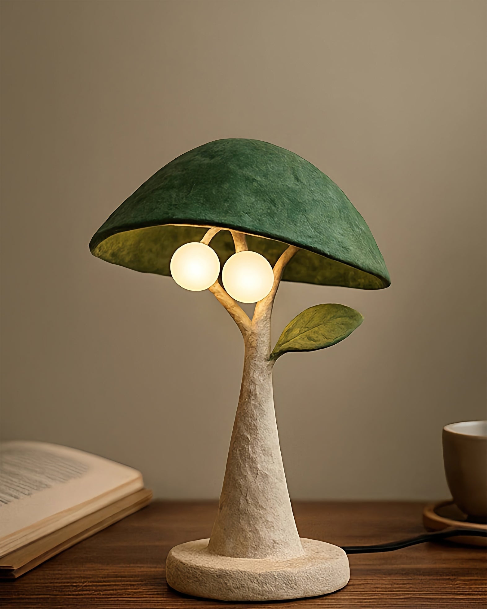 The Soloma Table Lamp shown on a bedside table, casting a warm glow.