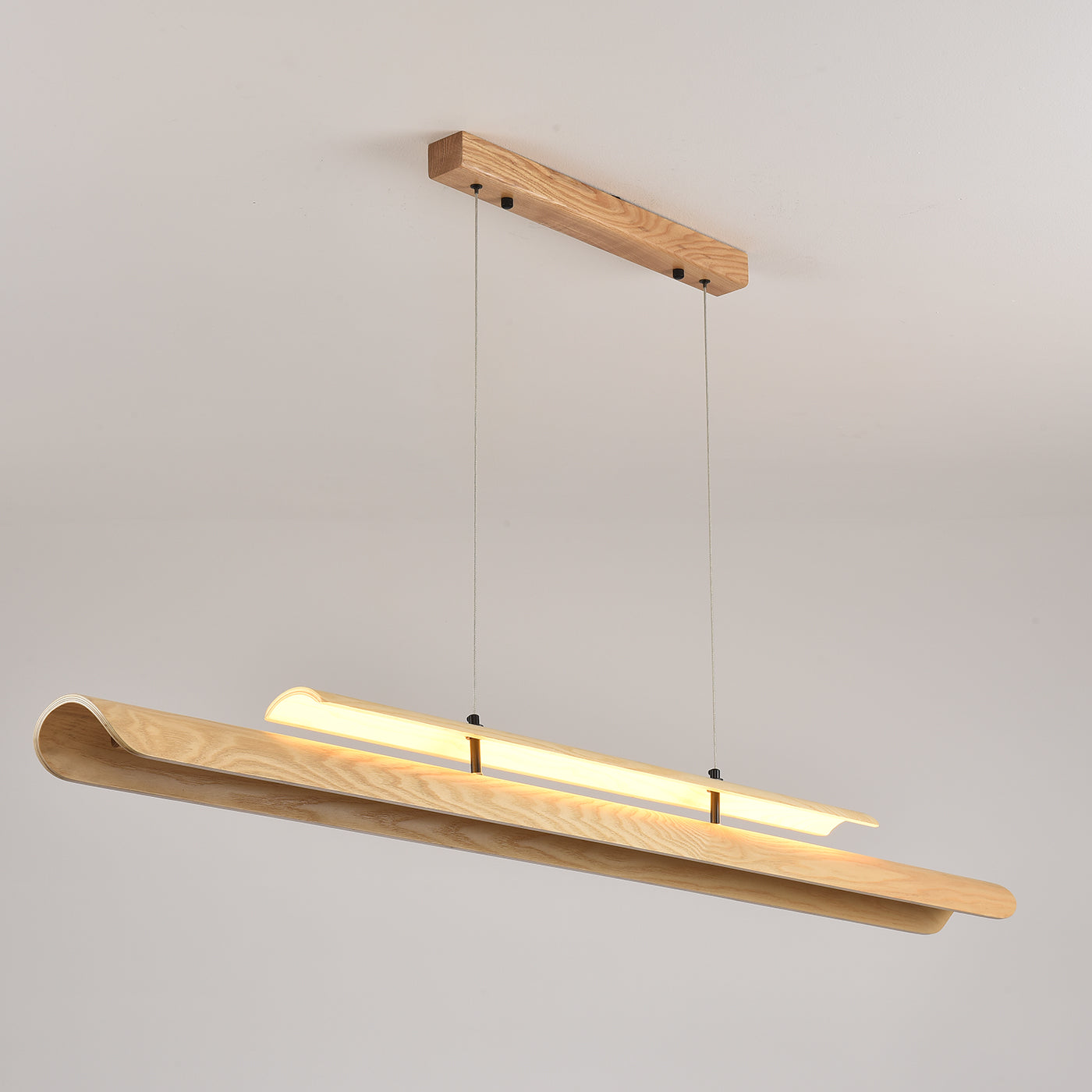 The indirect lighting effect cast on the ceiling by the chandelier.