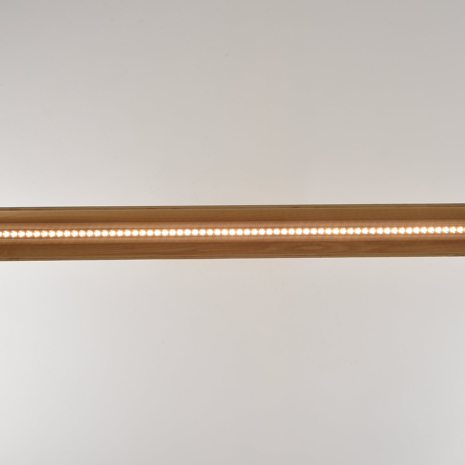 The 180cm version of the chandelier spanning a large table.
