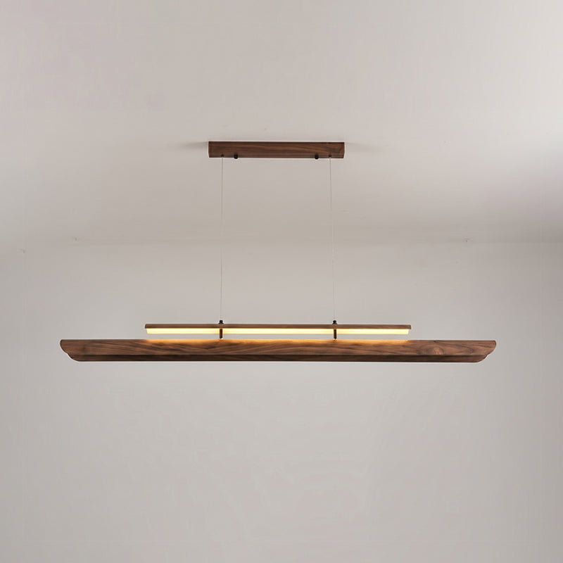 Sora Linear Chandelier turned on, emitting a warm glow.