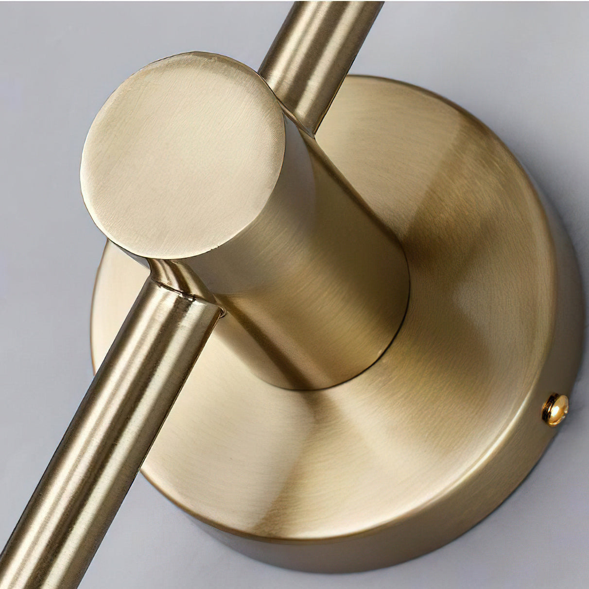 Detail shot of the gold finish and mounting hardware of the Sorle Wall Lamp.