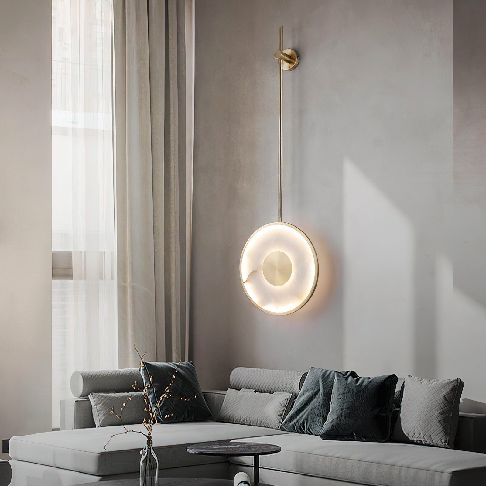 Close-up view of the glowing natural alabaster disc on the Sorle Wall Lamp.