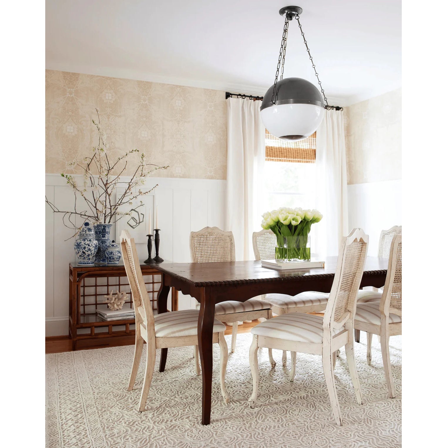 Lifestyle view of the Sphere No.2 Pendant Lamp in a modern dining area.