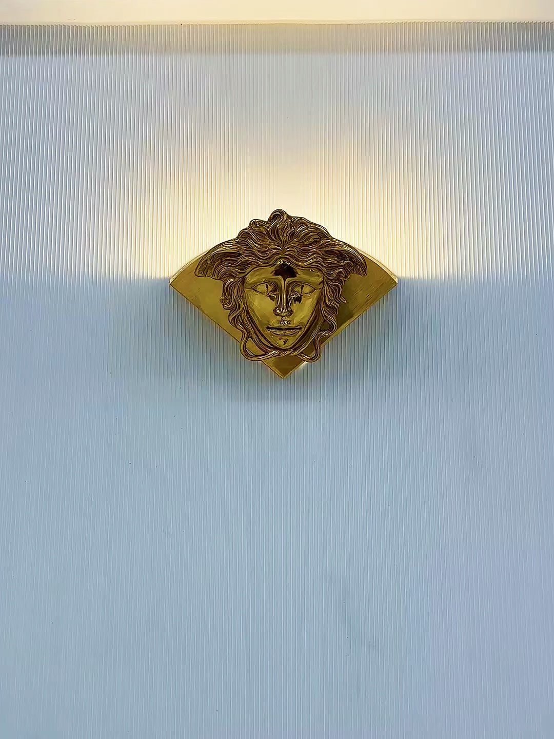 The lamp casting soft shadows on the wall, creating ambiance.