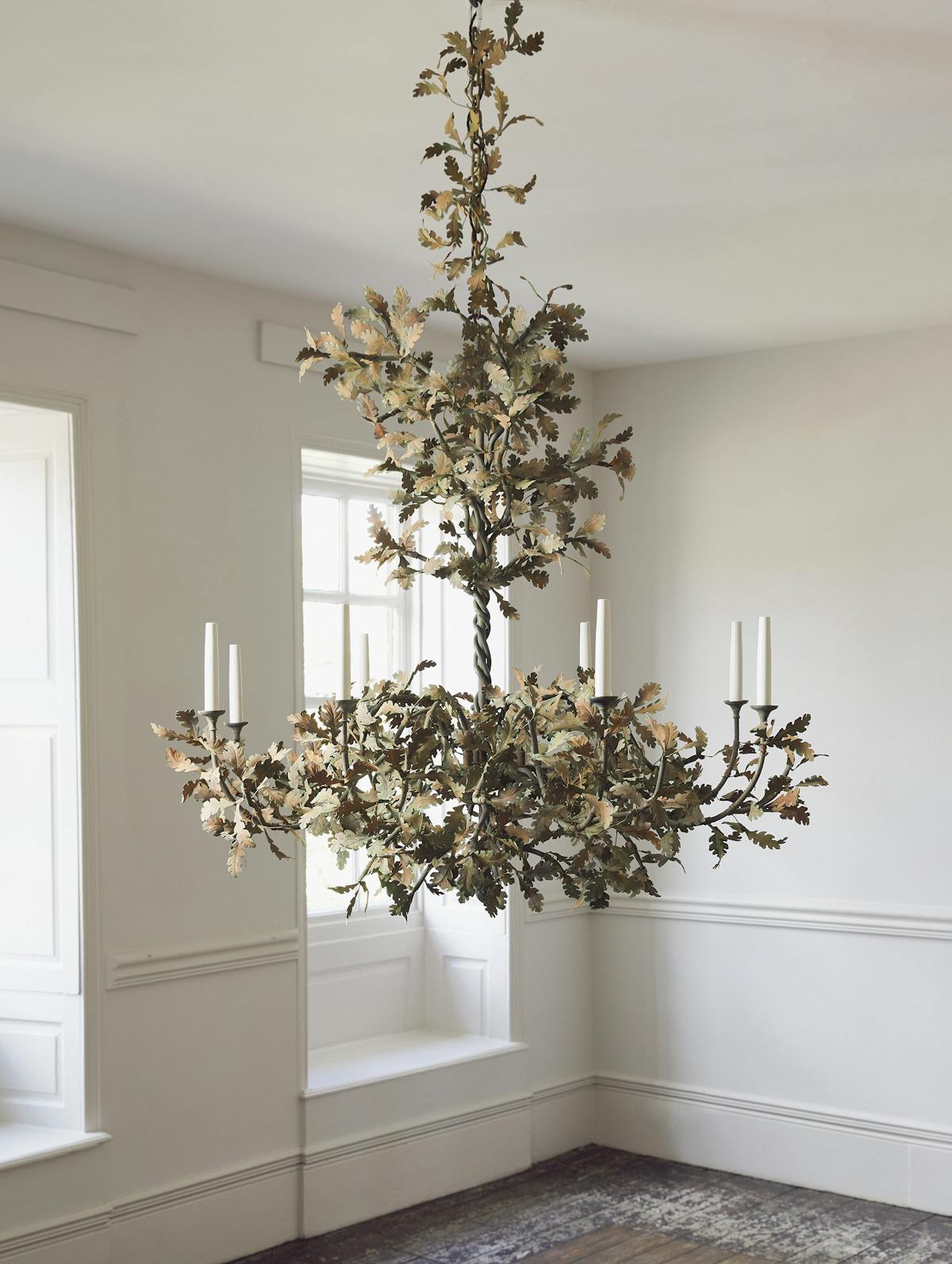 Detailed view of the hand-forged iron oak leaves on the chandelier.