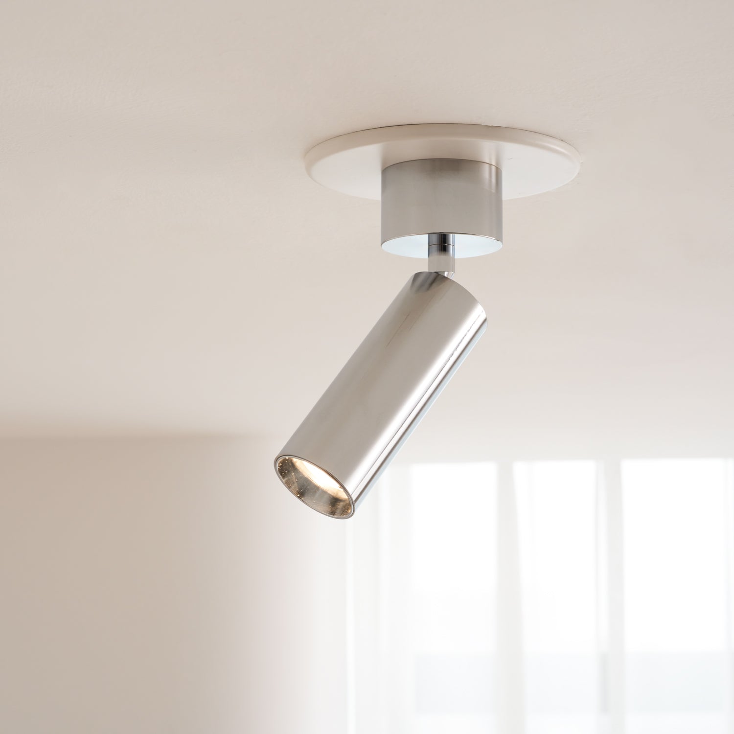 Stanly Ceiling Spotlight Lamp in silver, pointing straight down.