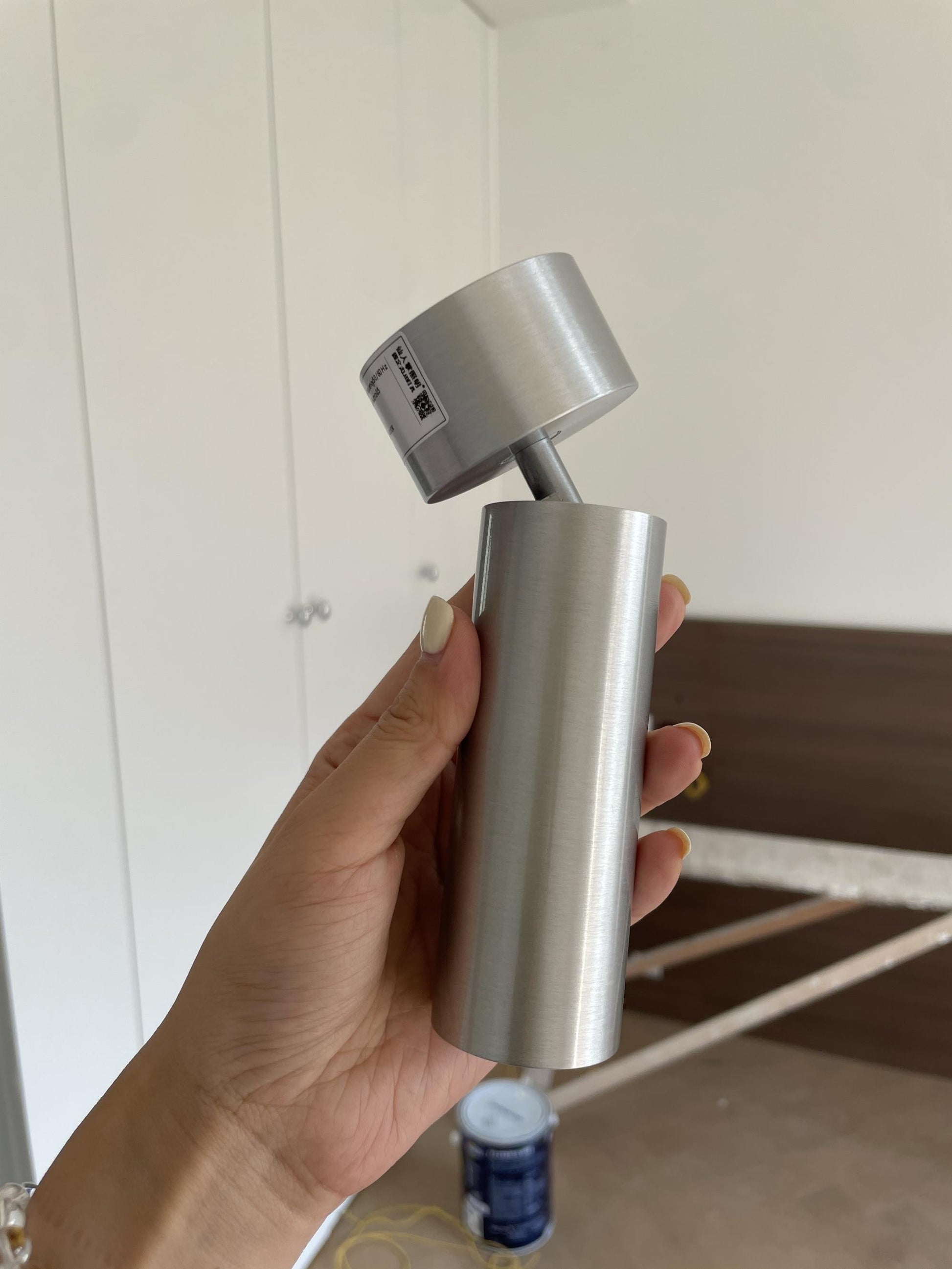 Stanly spotlight used as a wall-mounted reading light.