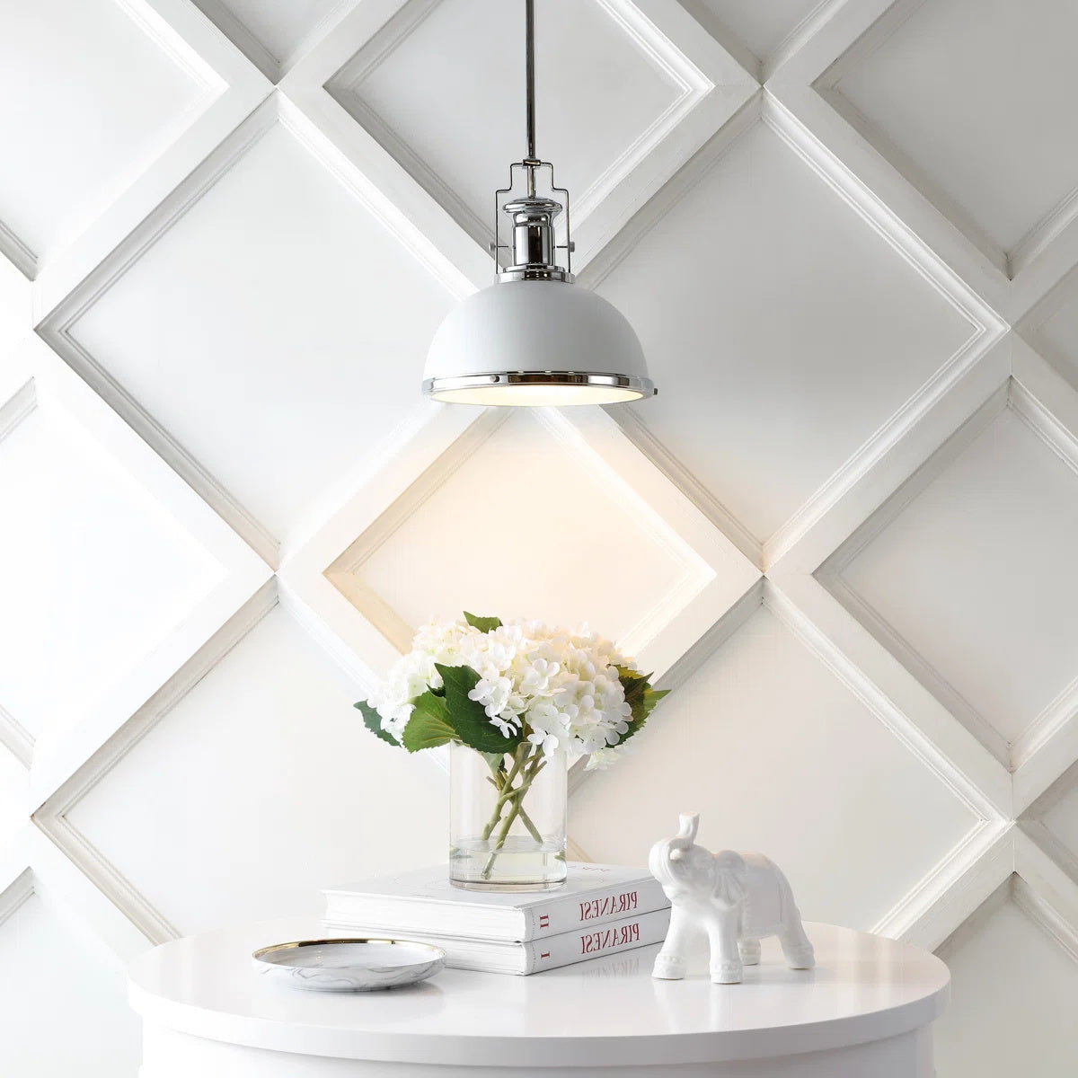 Staub Pendant Lamp illuminating a dining room table.