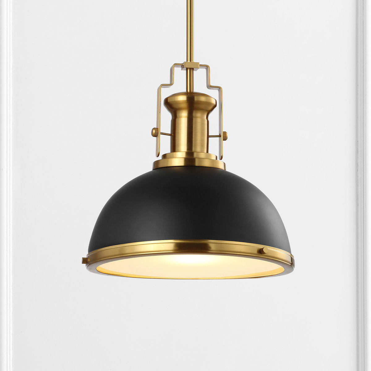 The four available finishes of the Staub Pendant Lamp: Brass, Chrome, White, and Black.