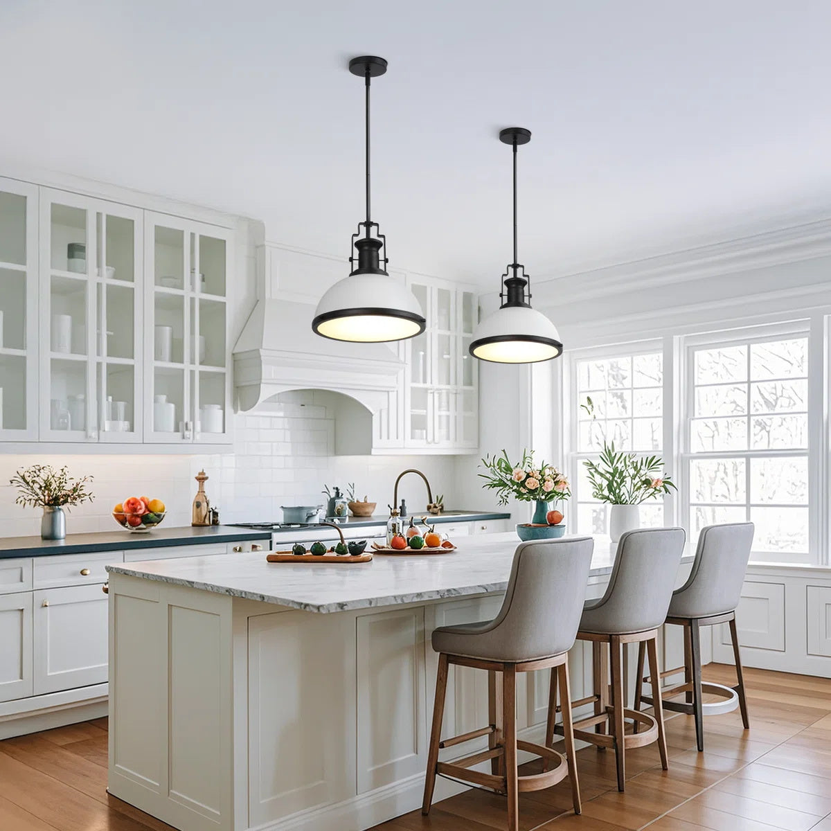 Angled view of the sleek chrome Staub Pendant Lamp.