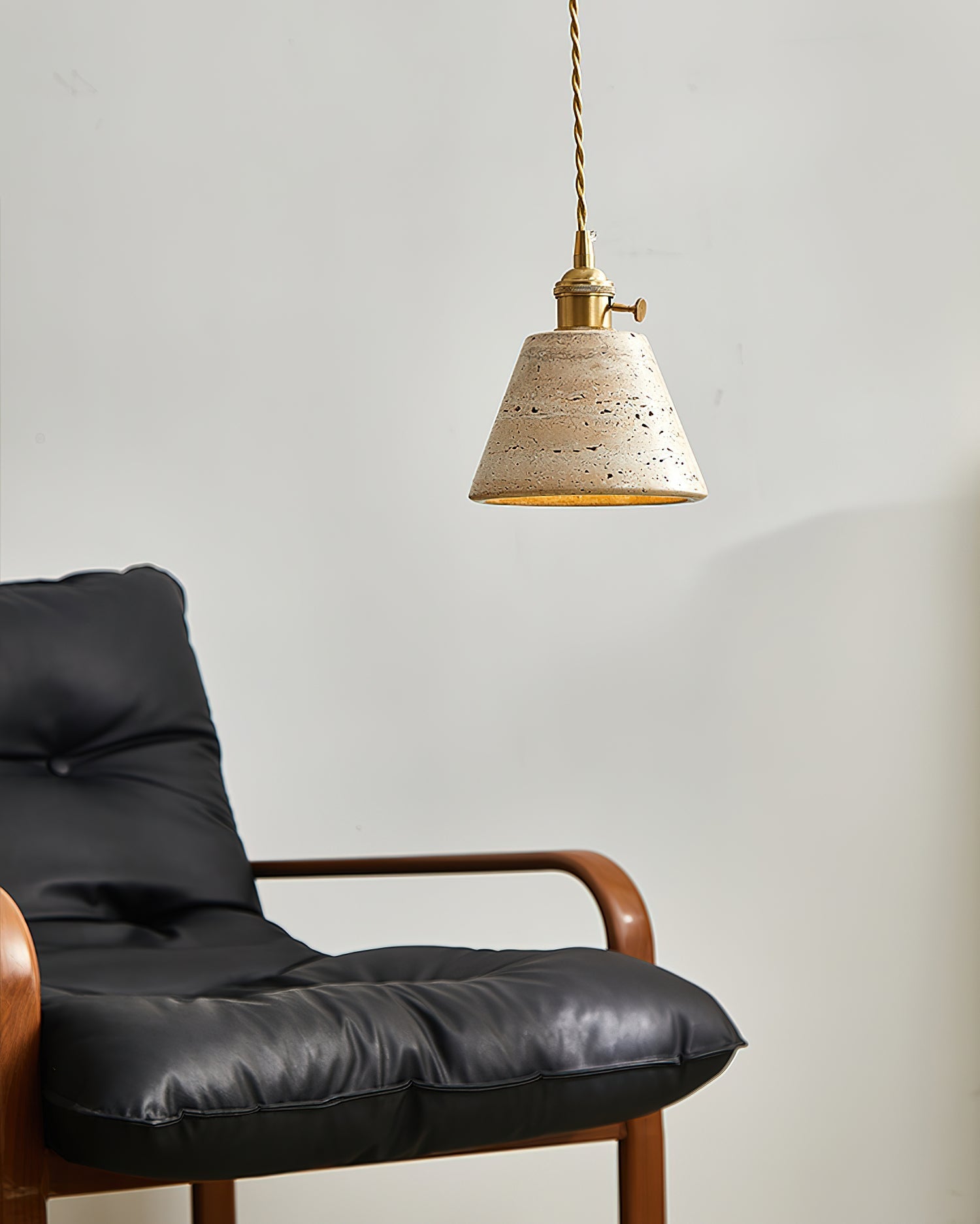 Stella Pendant Light hanging over a dining area, providing a focused glow.